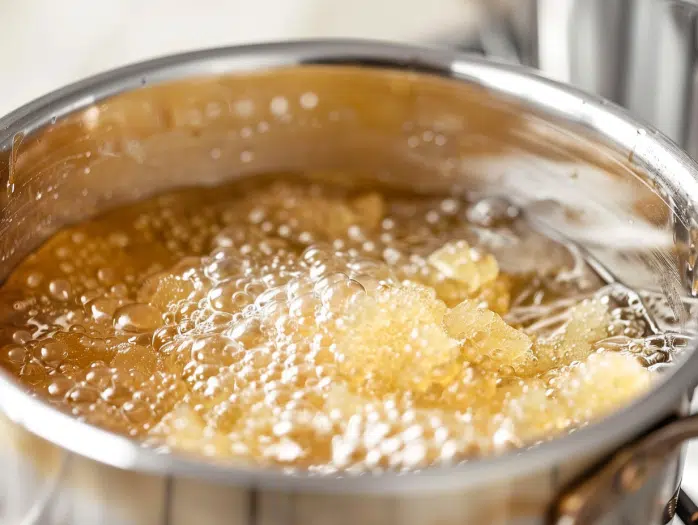Gelatin blooming in water showing proper technique for making Swedish candy
