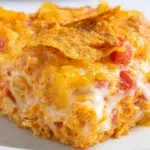 Dorito chicken casserole baked with shredded chicken, creamy sauce, and crunchy Doritos topping